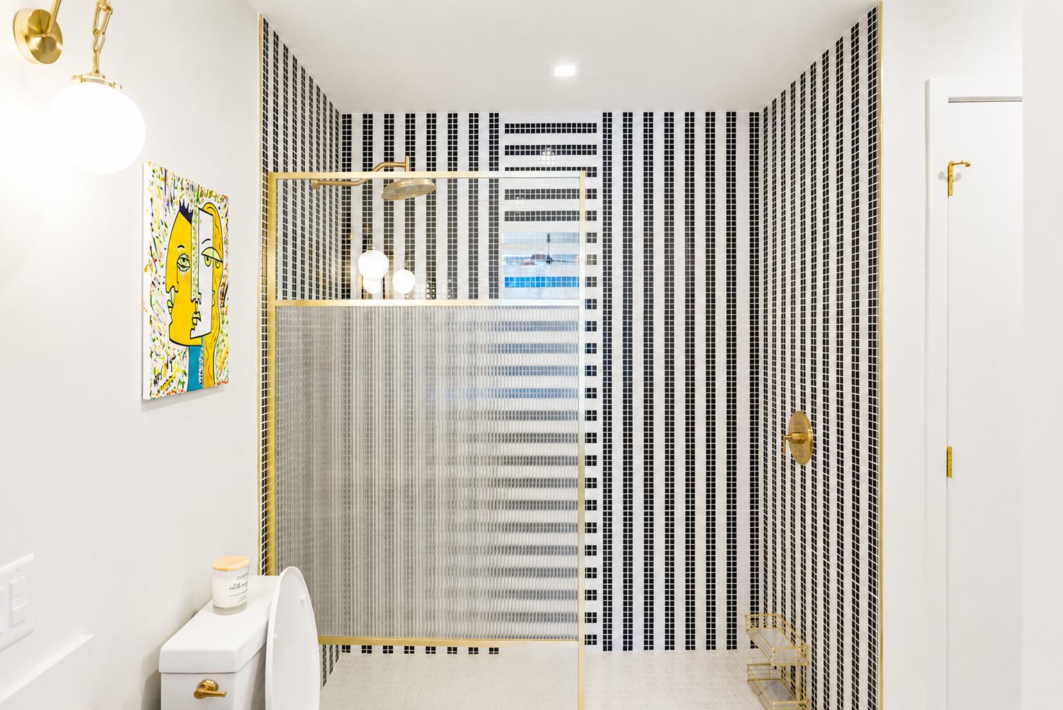 Walk-in shower — floor-to-ceiling mosaic tile, gold frame, city view