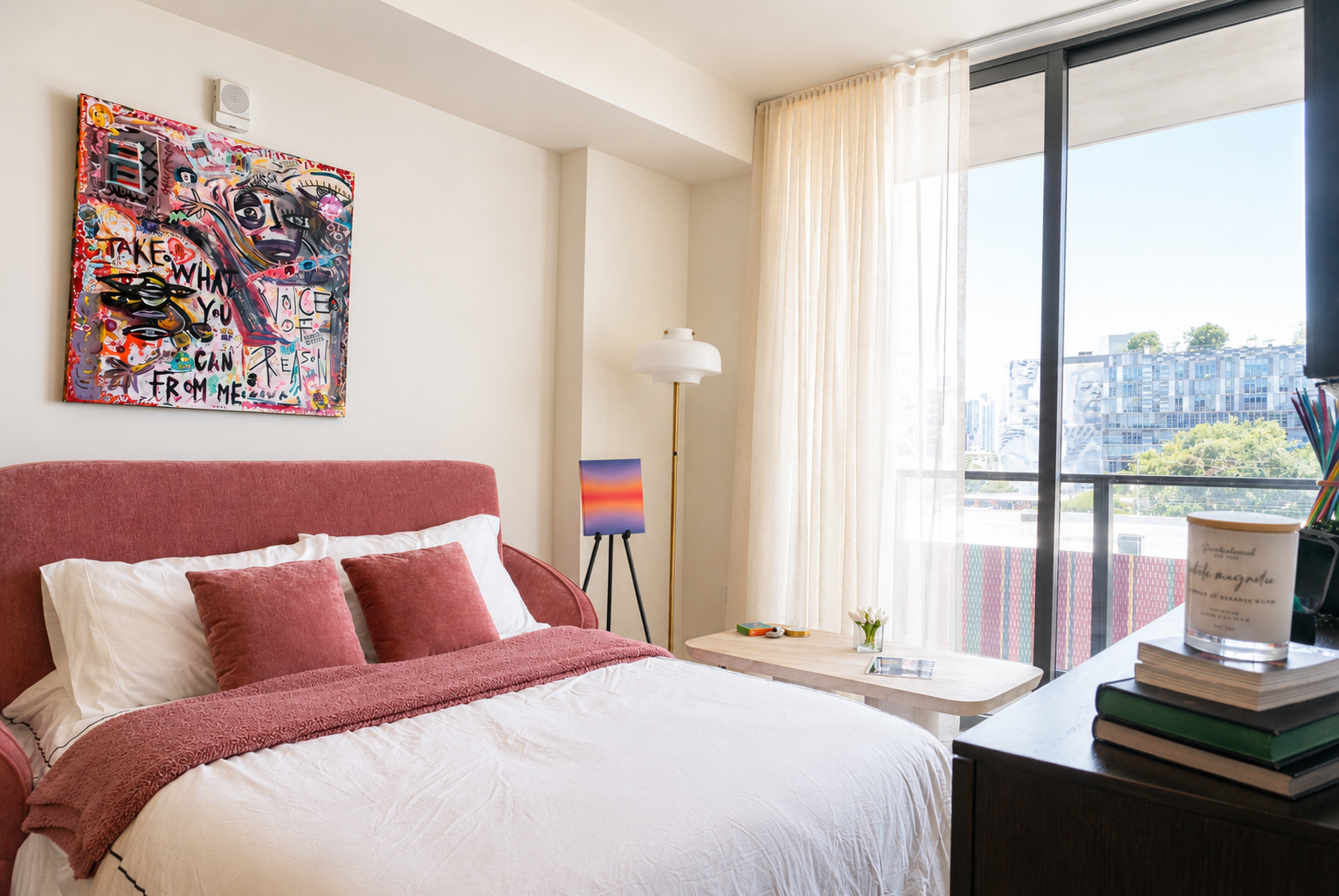Bedroom with art and floor-to-ceiling windows