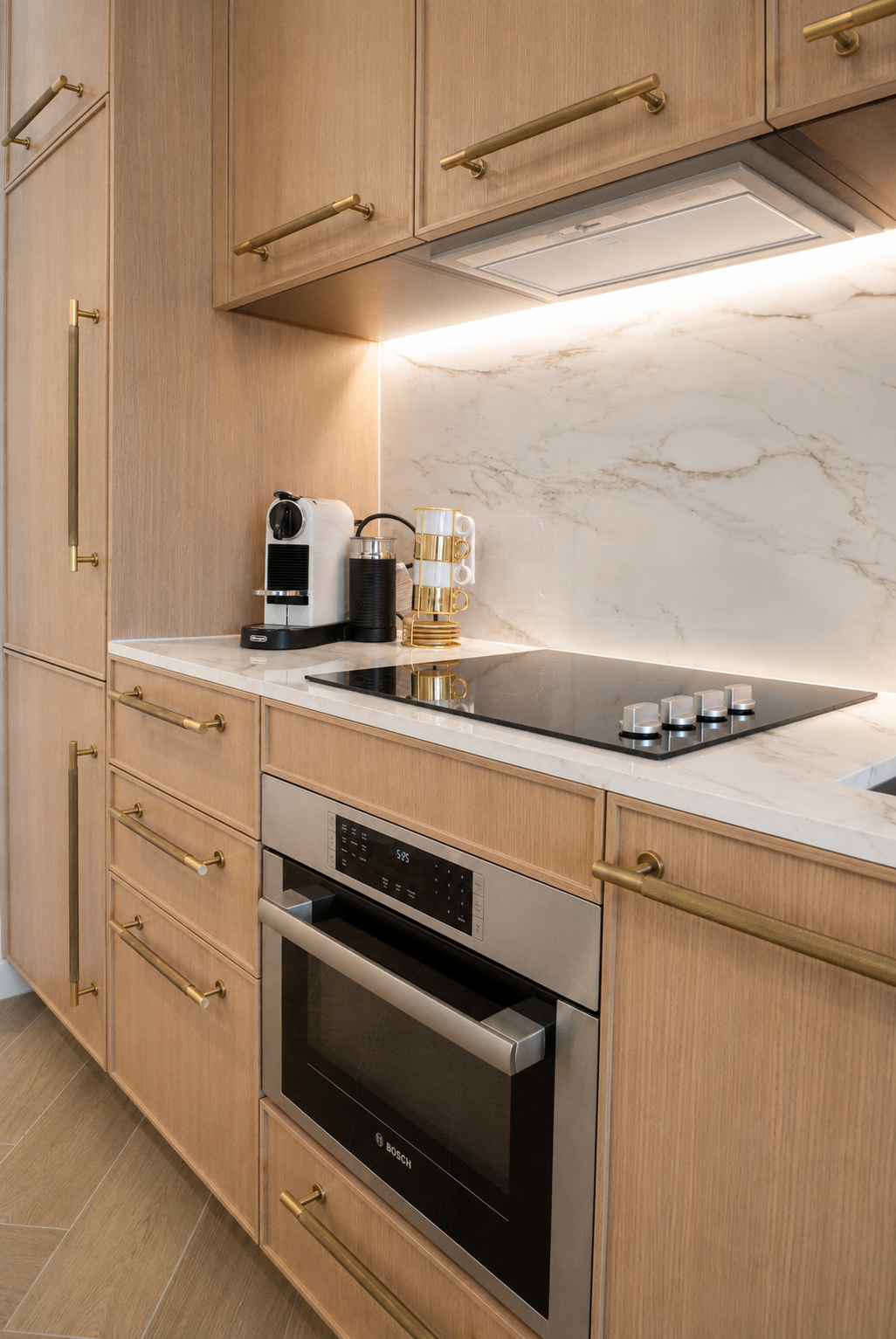 Kitchen — Calacatta marble, Bosch oven, brass hardware