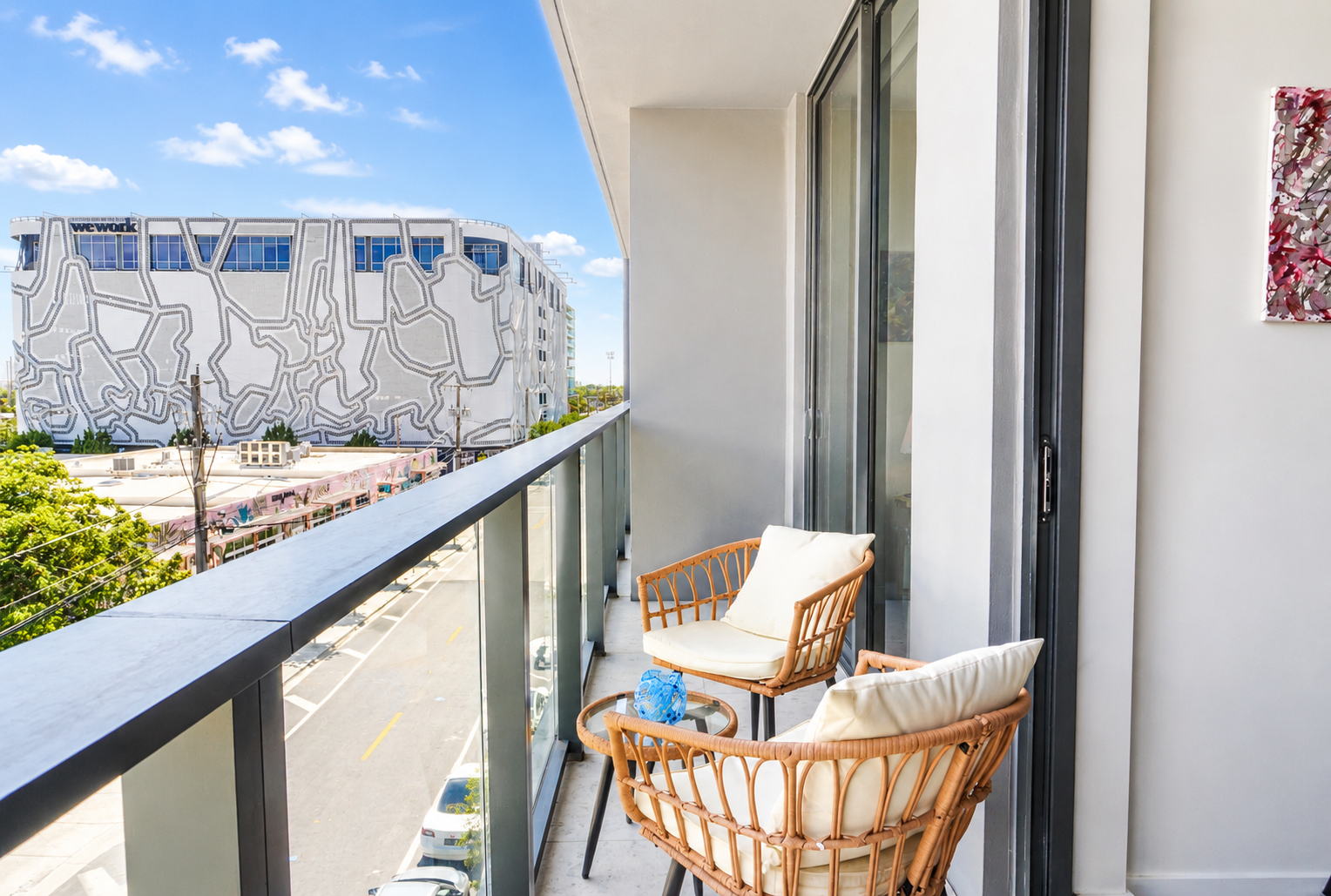 Private balcony — rattan chairs, Wynwood street art views