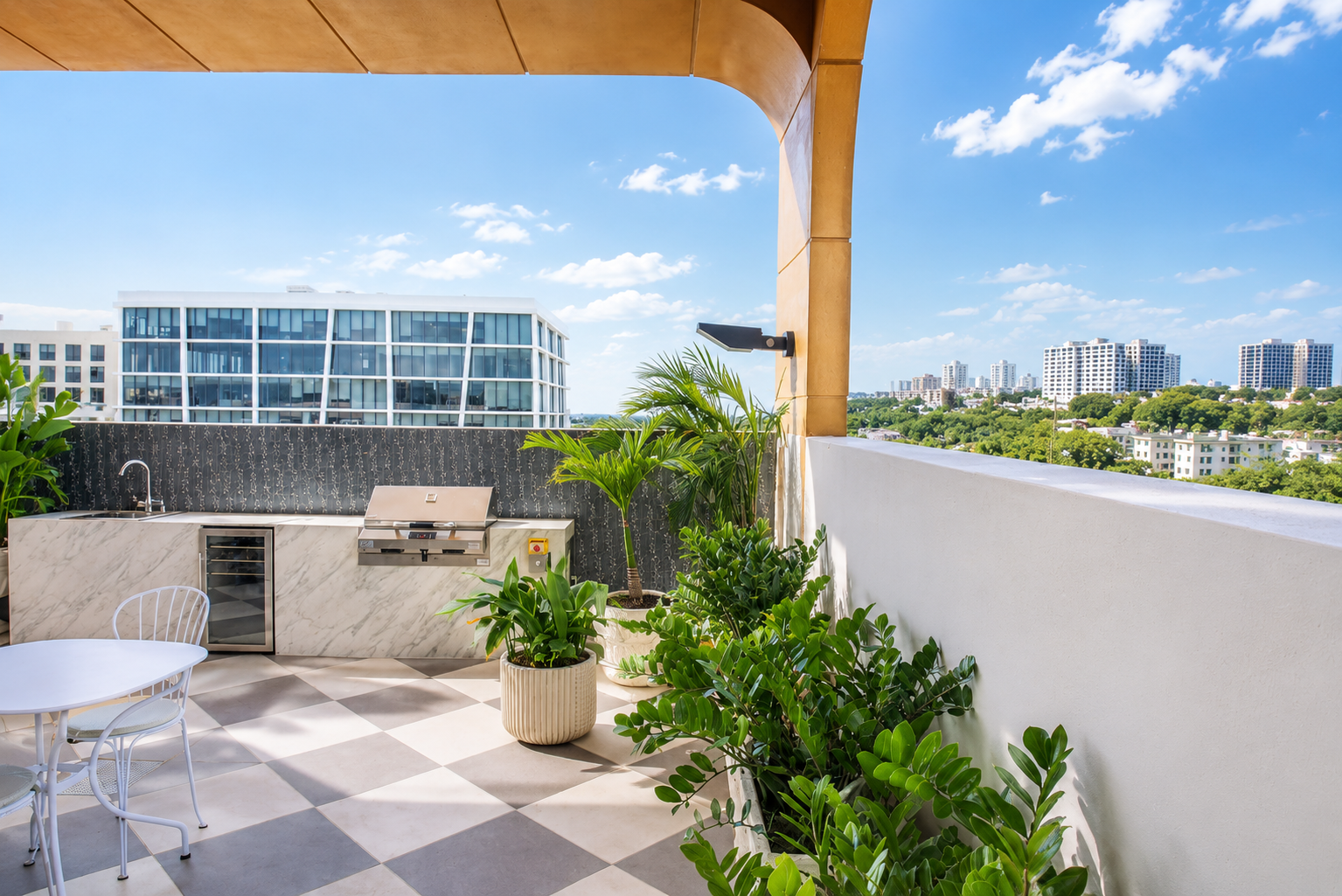 Outdoor kitchen — marble counters, grill, Wynwood skyline